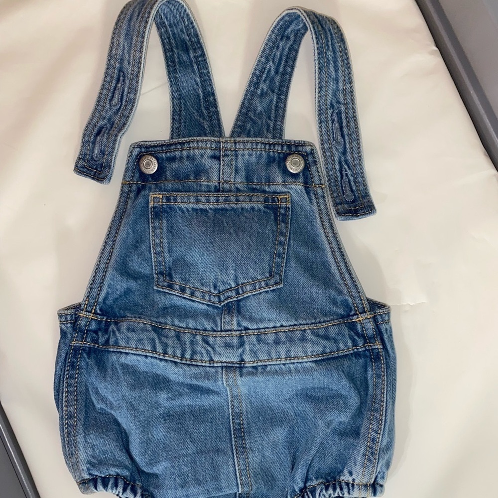 One piece denim unisex overalls.